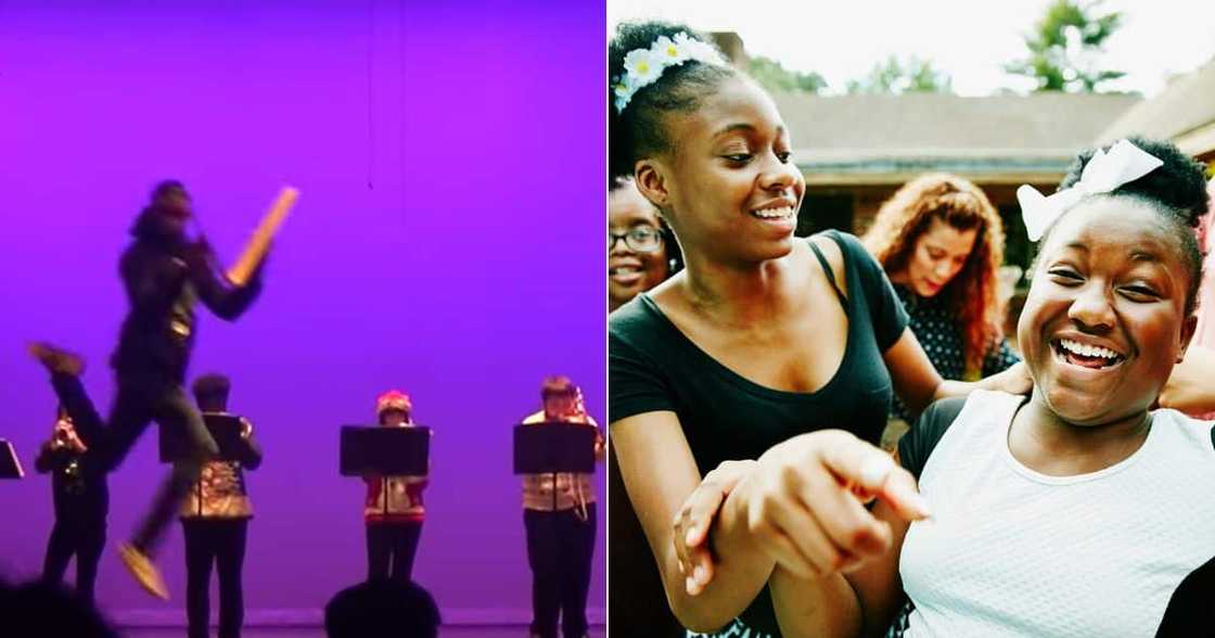 School kid playing slapstick School kid playing slapstick