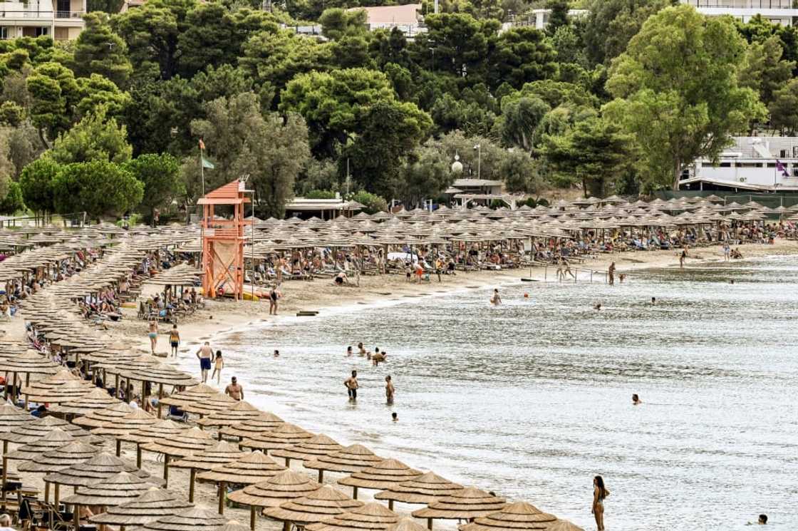 Oceanis beach, south of Athens, is packed with parasols and sun loungers Oceanis beach, south of Athens, is packed with parasols and sun loungers