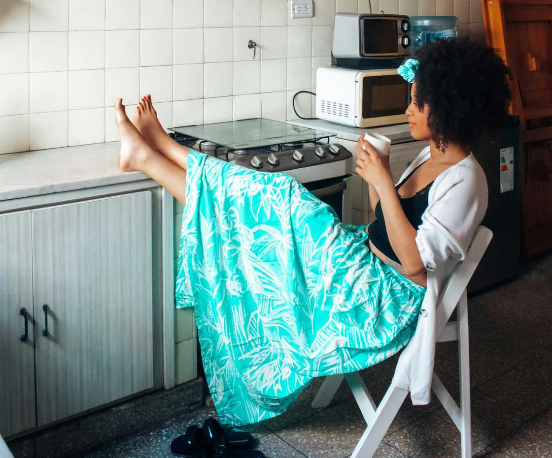 A woman relaxing in the kitchen