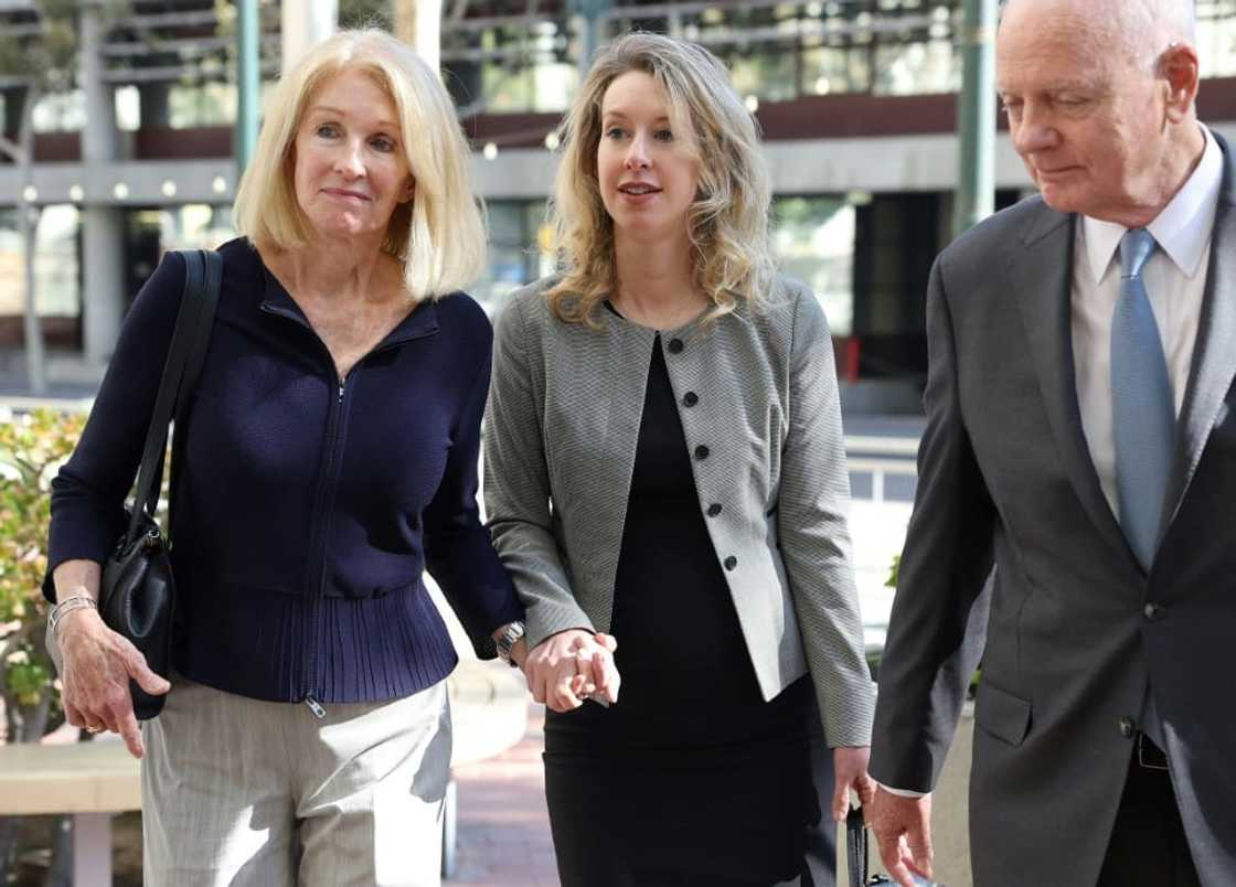A US judge ruled against a new trial for Theranos founder Elizabeth Holmes, shown here with her parents A US judge ruled against a new trial for Theranos founder Elizabeth Holmes, shown here with her parents