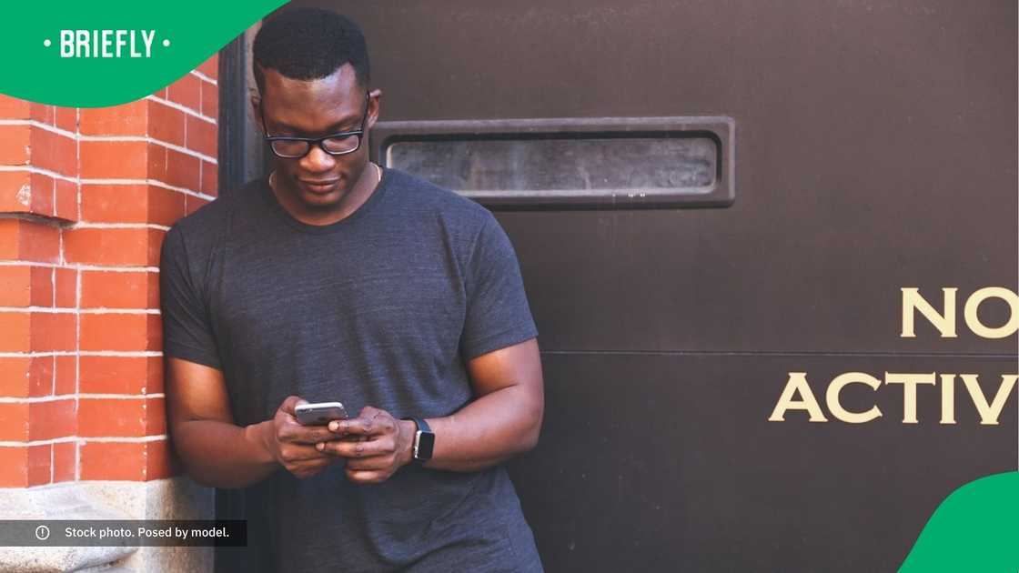 A man typing on his phone.