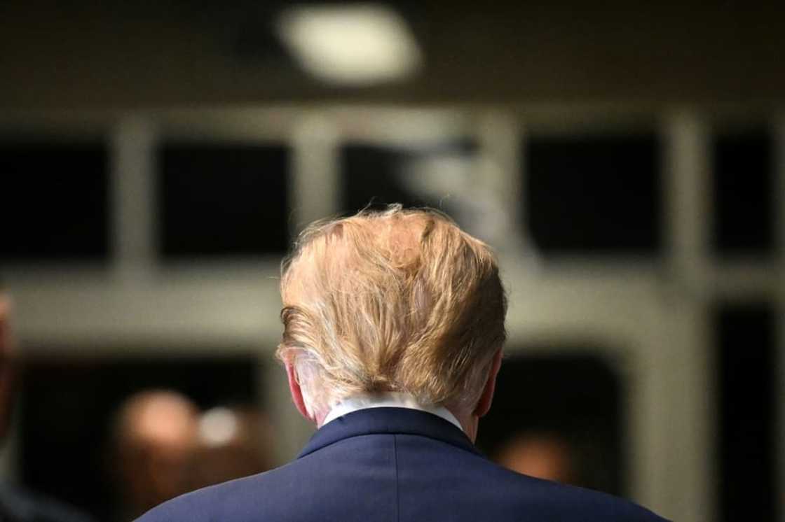 Former US President Donald Trump walks to the courtroom after speaking to the press at Manhattan Criminal Court in New York City on February 15, 2024 Former US President Donald Trump walks to the courtroom after speaking to the press at Manhattan Criminal Court in New York City on February 15, 2024
