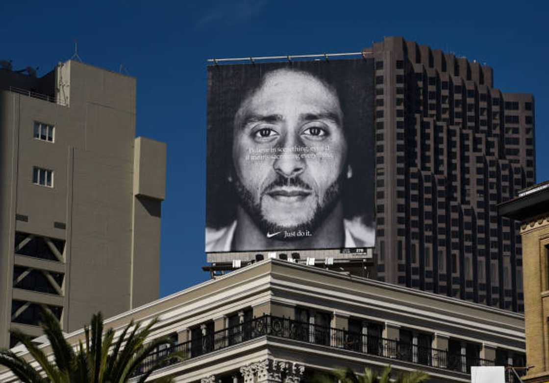 A Nike billboard featuring a portrait of Colin Kaepernick A Nike billboard featuring a portrait of Colin Kaepernick
