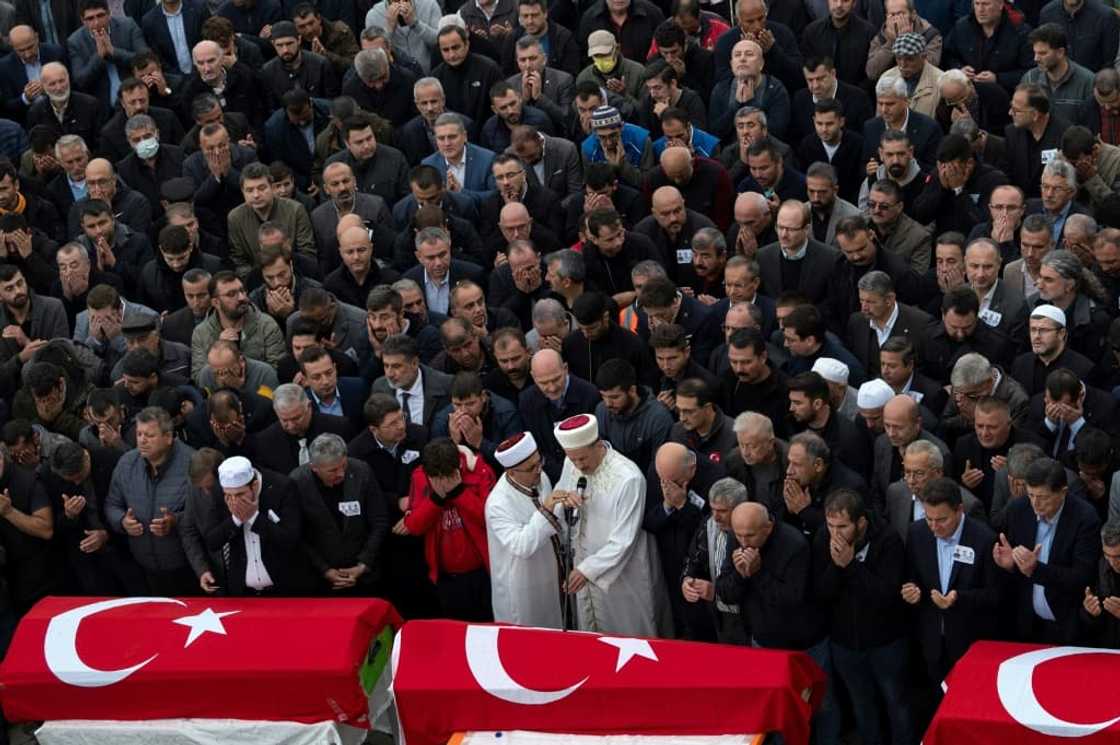 Hundreds of people gathered as an imam led the funeral service Hundreds of people gathered as an imam led the funeral service