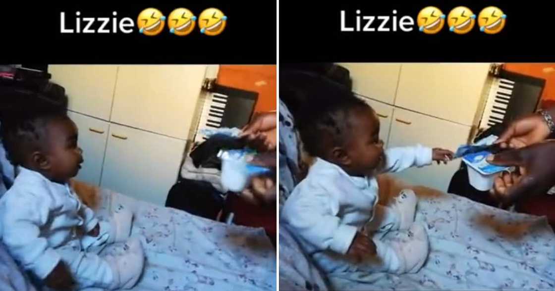 A cute baby girl chose a R100 note over some yoghurt. A cute baby girl chose a R100 note over some yoghurt.