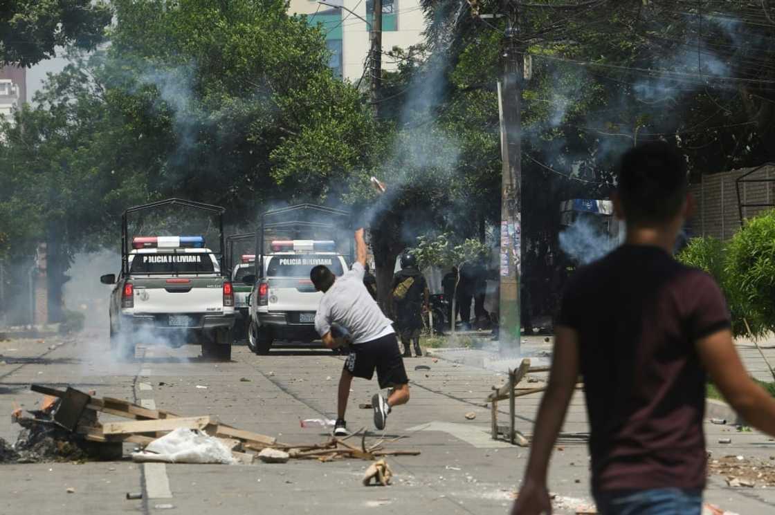 Protesters clash with riot police in the streets of Santa Cruz, Bolivia, on November 11, 2022 Protesters clash with riot police in the streets of Santa Cruz, Bolivia, on November 11, 2022