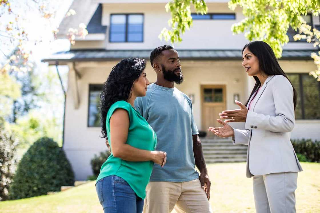 A real estate agent talking to clients A real estate agent talking to clients