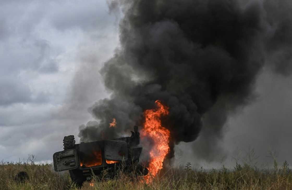 A military vehicle burns outside of the Izyum, a city recaptured by Ukraine troops A military vehicle burns outside of the Izyum, a city recaptured by Ukraine troops