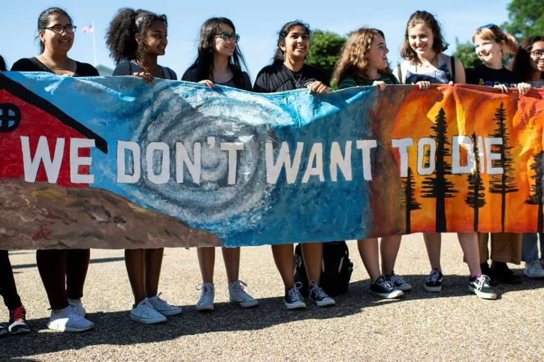 Young Americans protest outside the White House in Washington, DC during a "Fridays for Future" march in 2019 Young Americans protest outside the White House in Washington, DC during a "Fridays for Future" march in 2019