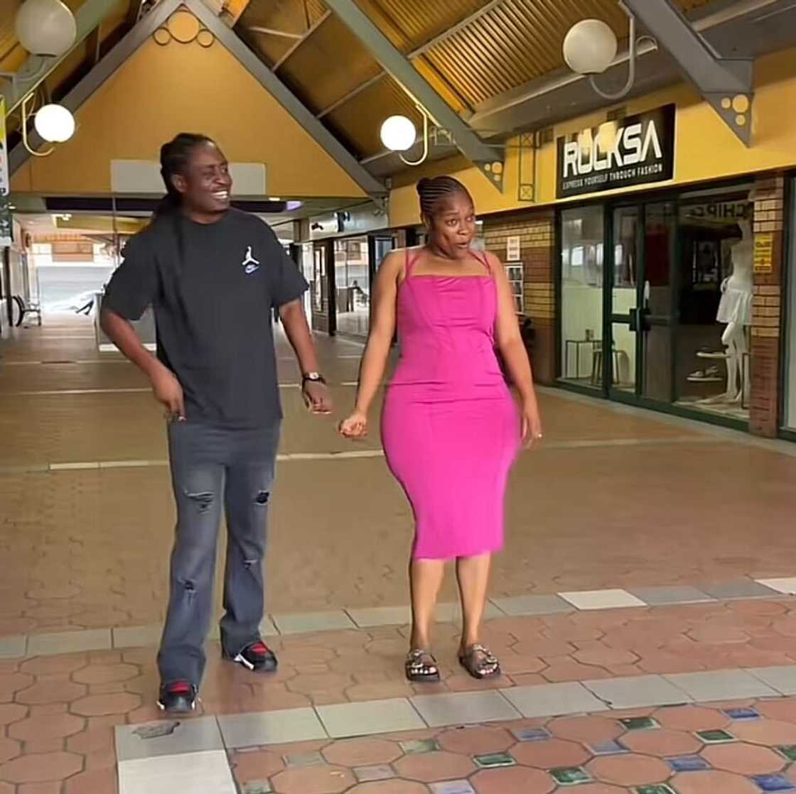A woman's dramatic approach to taking her husband to the ATM during bonus season has gone viral. A woman's dramatic approach to taking her husband to the ATM during bonus season has gone viral.
