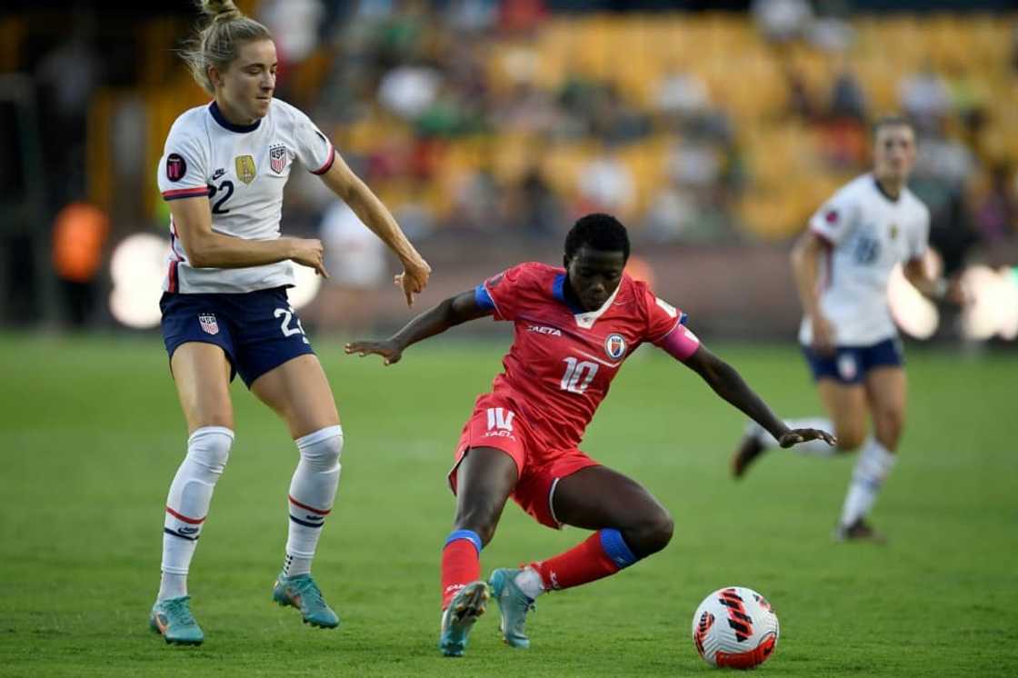 The United States' Kristie Mewis (L) vies for the ball with Haiti's Nerilia Mondesir during the CONCACAF W tournament in Monterrey, Mexico The United States' Kristie Mewis (L) vies for the ball with Haiti's Nerilia Mondesir during the CONCACAF W tournament in Monterrey, Mexico