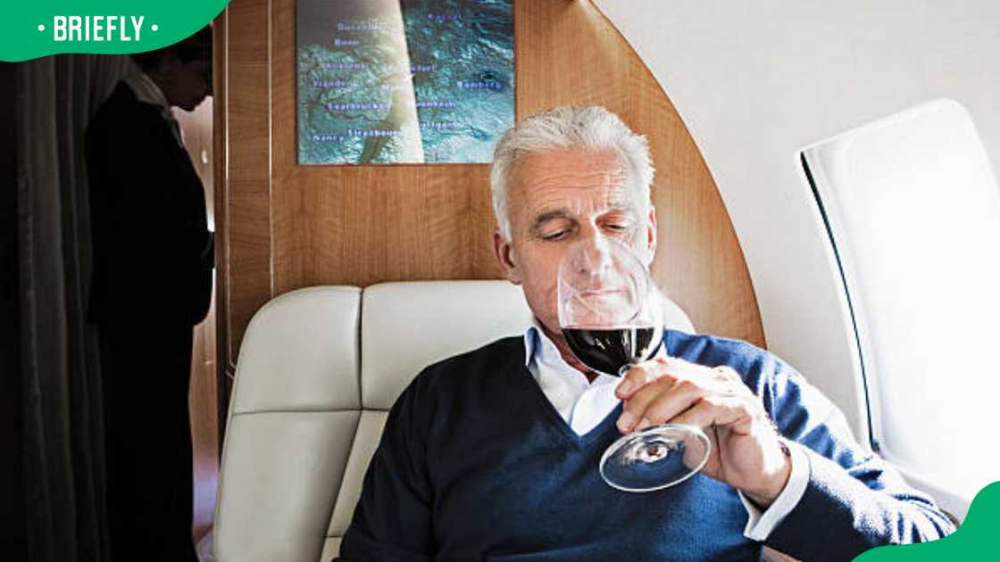 A traveller taking wine on an airplane A traveller taking wine on an airplane
