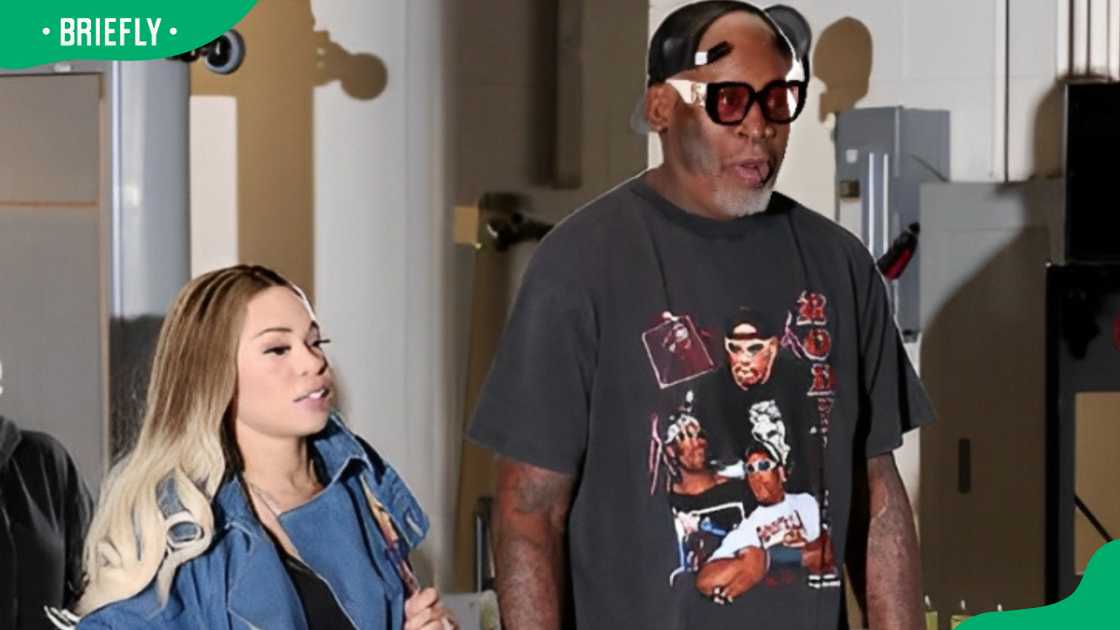 Dennis Rodman and girlfriend Yella Yella at the United Center Dennis Rodman and girlfriend Yella Yella at the United Center