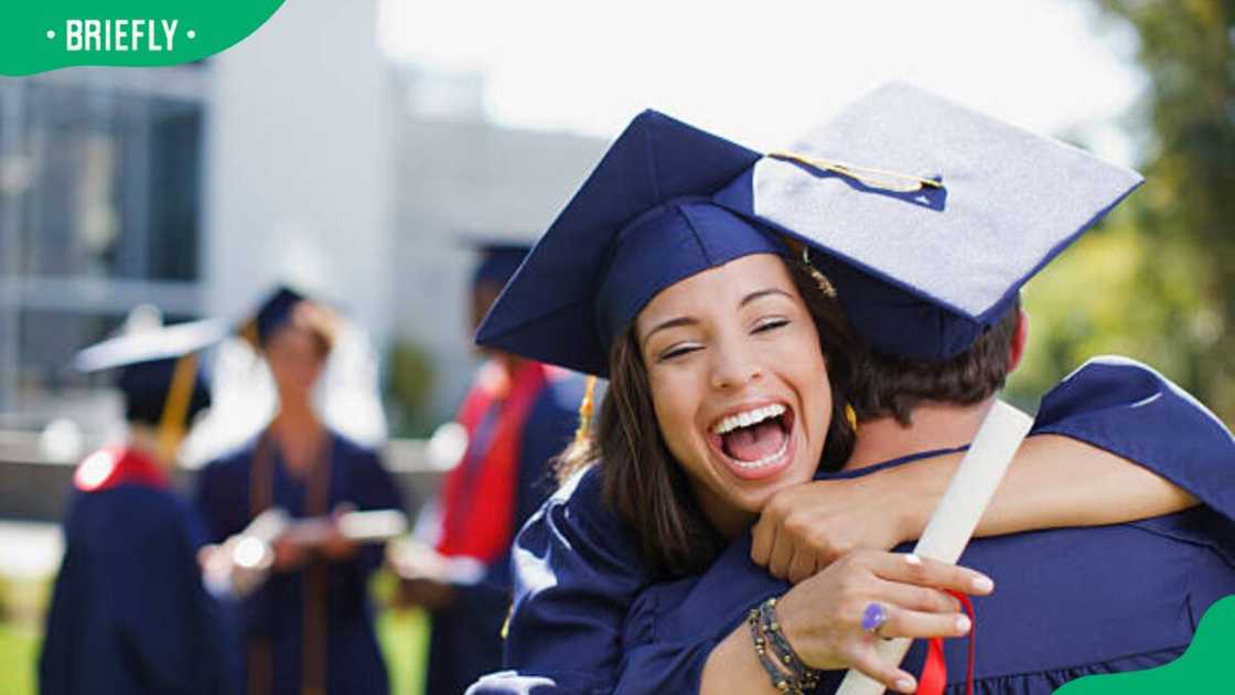 Graduates celebrating after graduation Graduates celebrating after graduation
