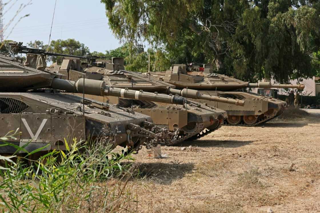 Israeli tanks deploy along the Gaza border as the army places more restrictions on the movement of Israeli civilians in communities nearby Israeli tanks deploy along the Gaza border as the army places more restrictions on the movement of Israeli civilians in communities nearby