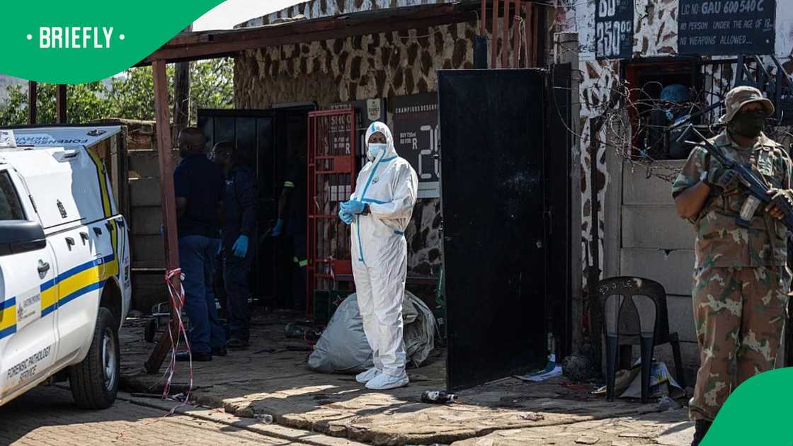 Members of South Africa's Forensic Pathology Service and South African National Defence Force (SANDF) inspect and secure the scene where gunmen armed with assault rifles stormed a bar in Johannesburg on September 27, 2026 Members of South Africa's Forensic Pathology Service and South African National Defence Force (SANDF) inspect and secure the scene where gunmen armed with assault rifles stormed a bar in Johannesburg on September 27, 2026