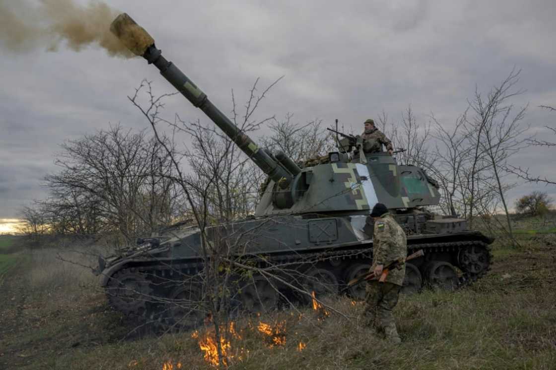 Ukrainian artillery unit members fire towards Kherson on October 28, 2022, outside of Kherson region Ukrainian artillery unit members fire towards Kherson on October 28, 2022, outside of Kherson region