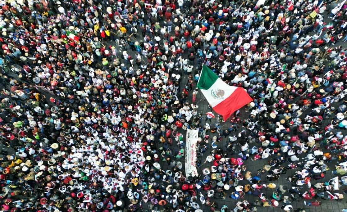 Mexico's president joined flag-waving crowds for a rally that comes as his allies warm up for the race to replace him in 2024