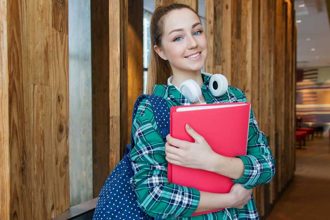 A student holding books