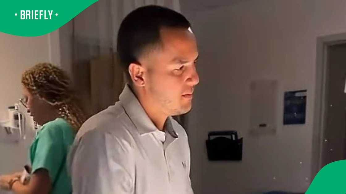 Man helps during delivery of his baby