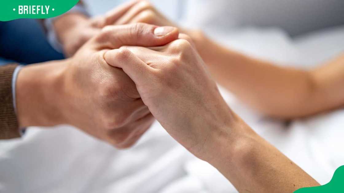 A man holding his loved one's hands