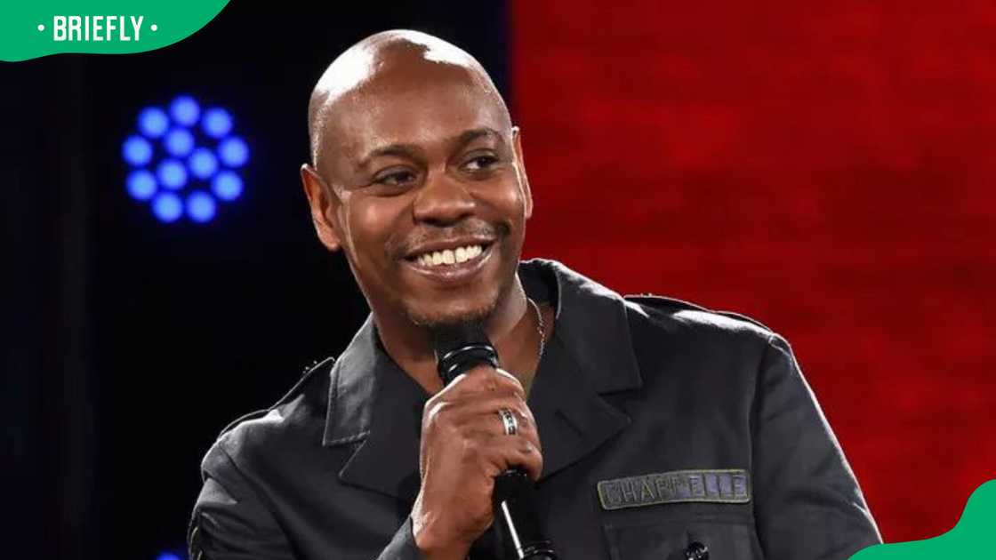 Dave Chappelle performing onstage Dave Chappelle performing onstage