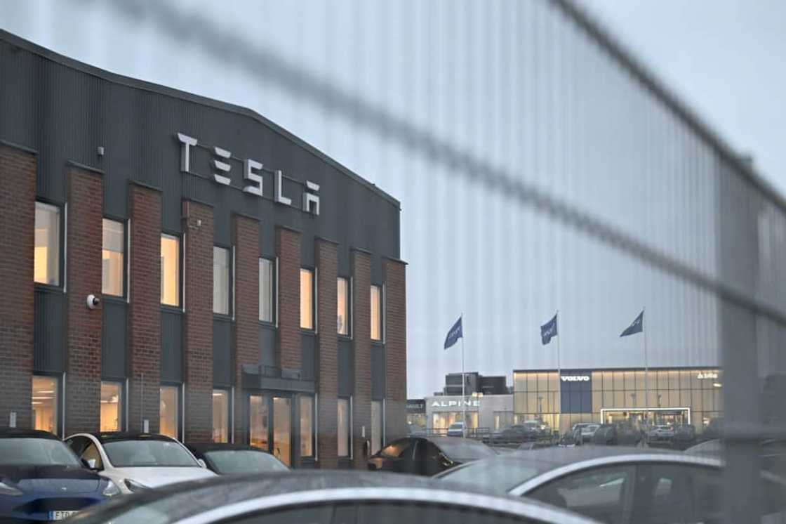 Swedish postal workers began halting deliveries to Tesla offices and repair shops on Monday, in support of a strike launched by the metal workers' union IF Metall over the electric carmaker's refusal to sign a collective wage agreement