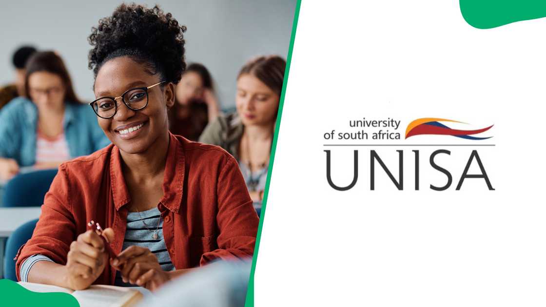 Happy female student attending a lecture in university classroom