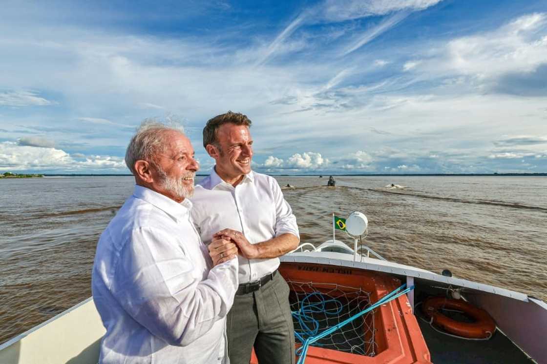 Brazil President Lula and French President Emmanuel Macron hold hands as they share a bilateral meeting while sailing at Guajara Bay off Belem, Brazil, on March 26, 2024 in this handout image from the Brazilian presidency Brazil President Lula and French President Emmanuel Macron hold hands as they share a bilateral meeting while sailing at Guajara Bay off Belem, Brazil, on March 26, 2024 in this handout image from the Brazilian presidency