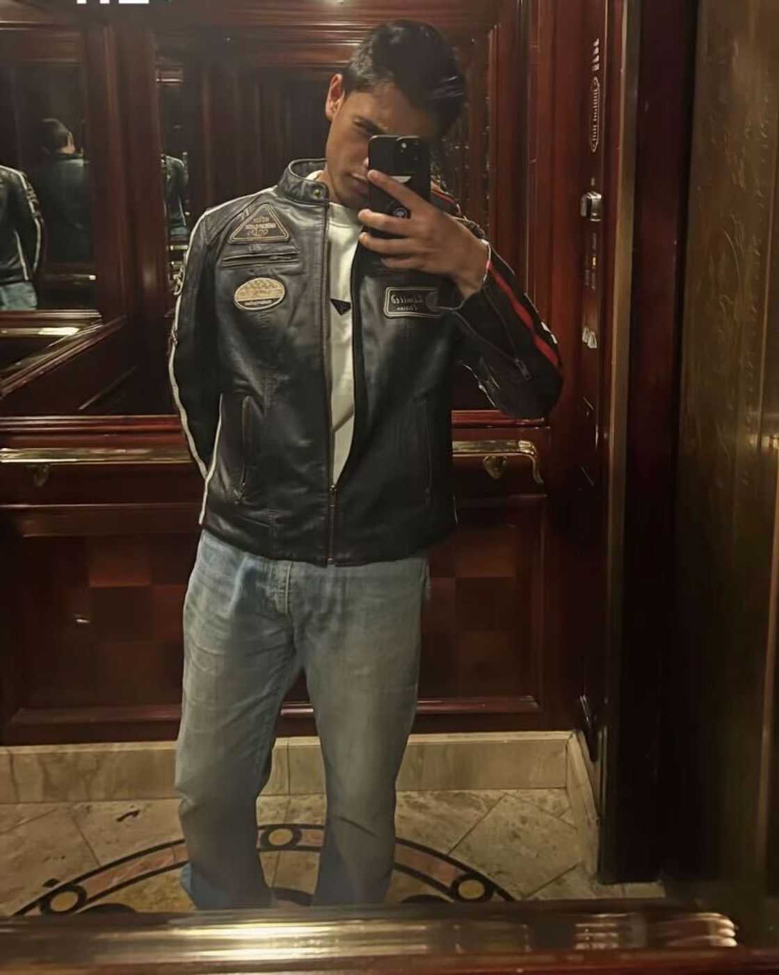 Santiago Andrew posed in a TikTok video dressed in blue jeans and a black leather jacket. Santiago Andrew posed in a TikTok video dressed in blue jeans and a black leather jacket.
