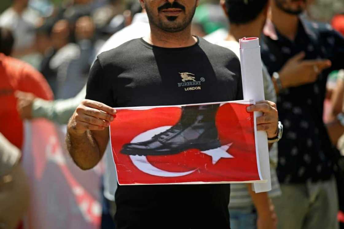 An Iraqi takes part in a demonstration in Baghdad against an attack on the country's autonomous Kurdistan region blamed on Turkey