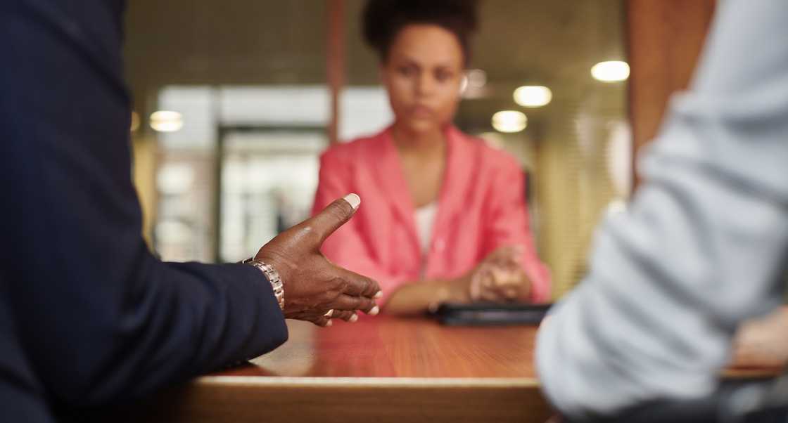 A sad woman in a meeting
