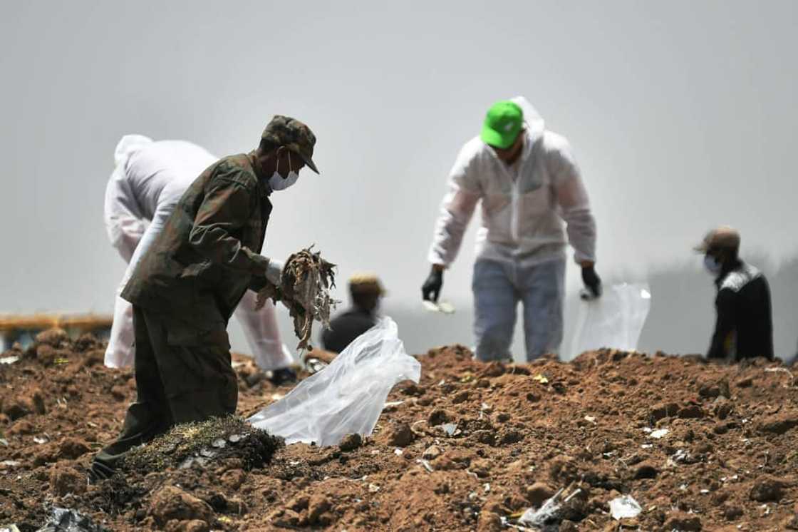 Forensics experts shown in March 2019 combing through the crash site of an Ethiopian Airlines operated Boeing 737 MAX aircraft Forensics experts shown in March 2019 combing through the crash site of an Ethiopian Airlines operated Boeing 737 MAX aircraft
