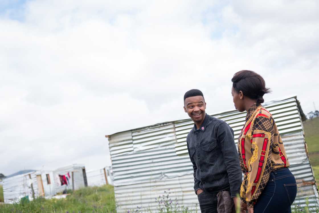 A lady and man talking