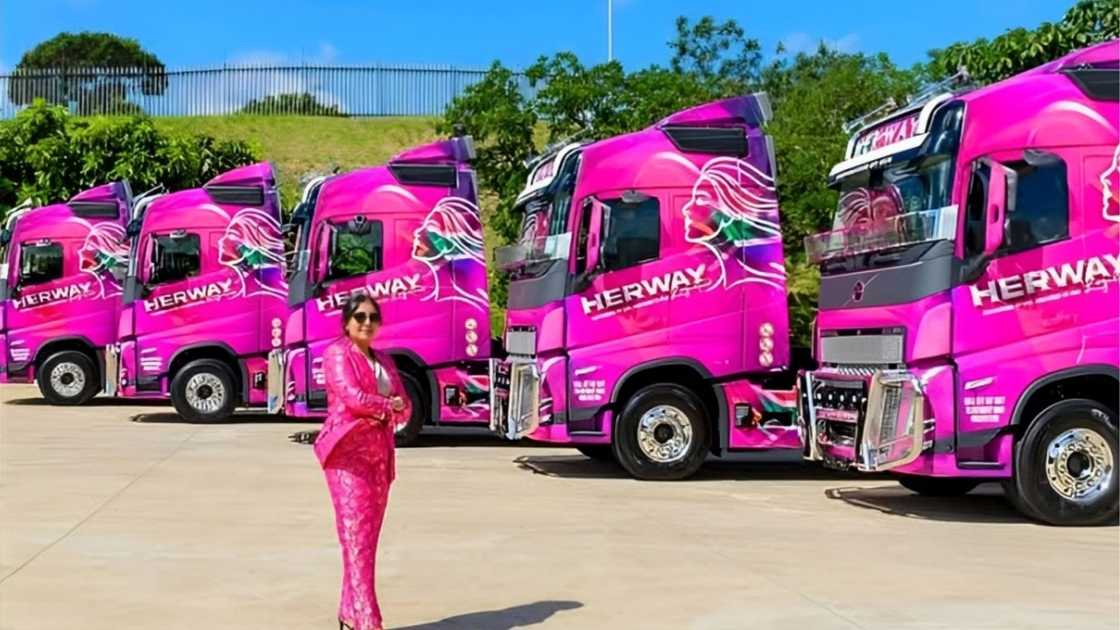 Kiara Baijnath poses with HerWay Logistics fleet