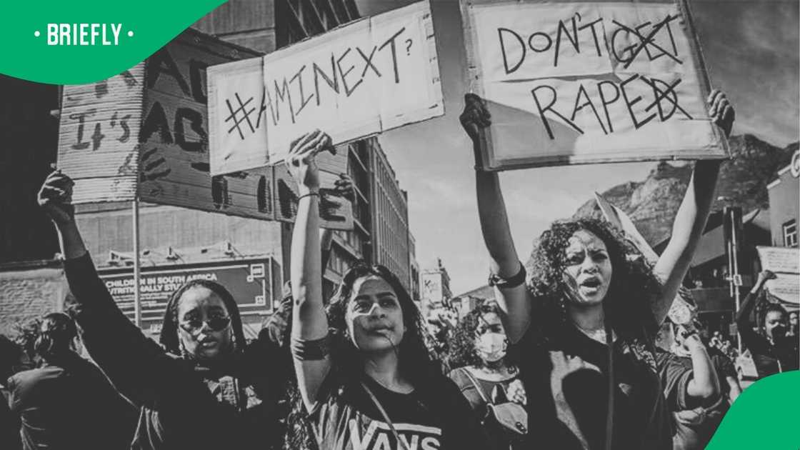 A picture of women marching against gender based violence. A picture of women marching against gender based violence.