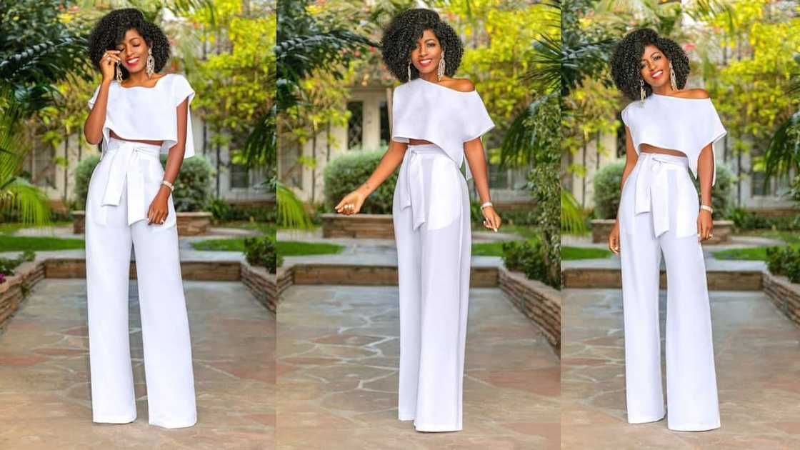 Two-piece side slit crop top with asymmetric neck and high-waist belted pants Two-piece side slit crop top with asymmetric neck and high-waist belted pants