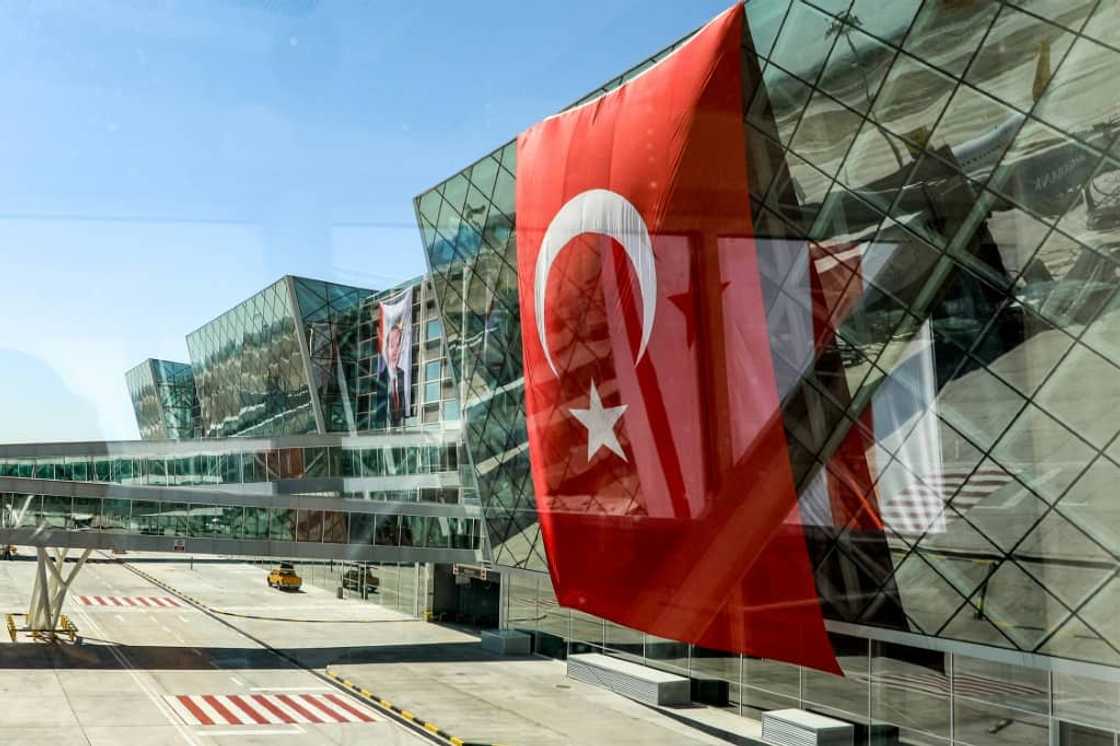A huge Turkish flag on the new terminal's facade for its inauguration by Turkey's President Recep Tayyip Erdogan A huge Turkish flag on the new terminal's facade for its inauguration by Turkey's President Recep Tayyip Erdogan