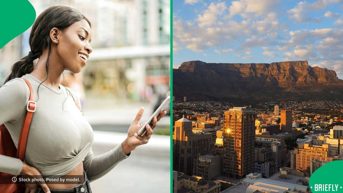 A woman looking at her phone, picture of Table Mountain. A woman looking at her phone, picture of Table Mountain.