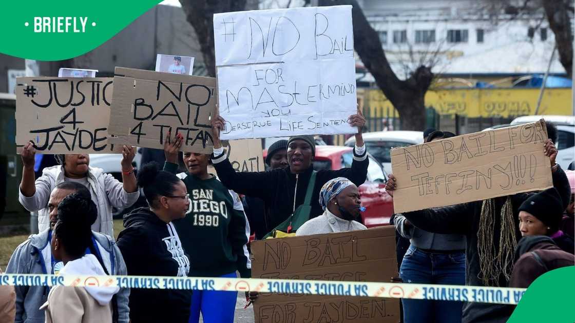 Community members protested outside the courtroom Community members protested outside the courtroom