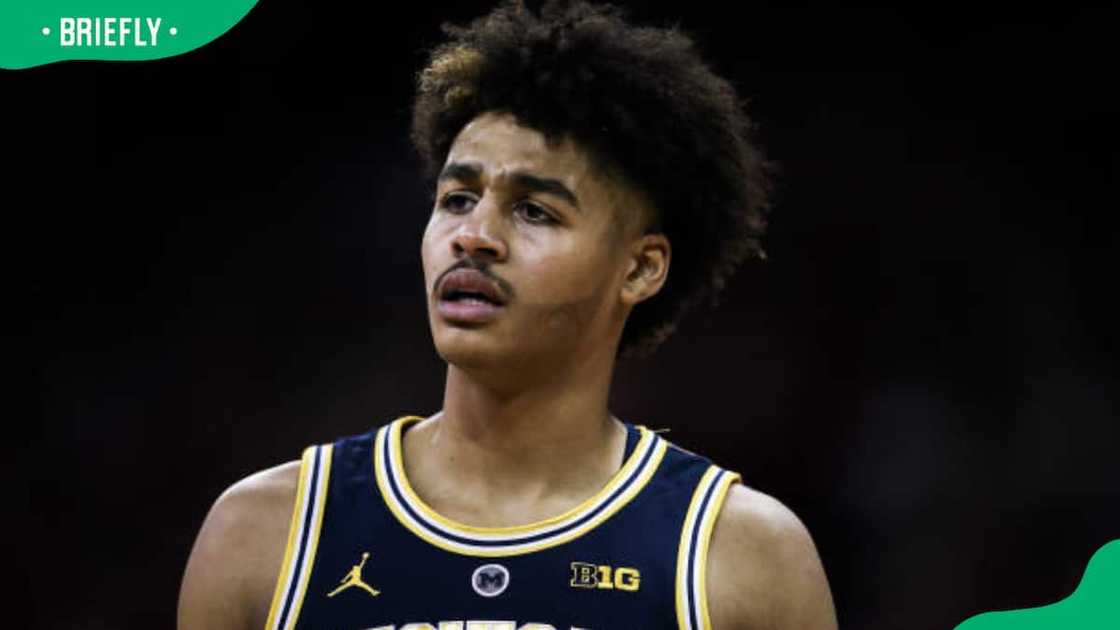Jordan Poole walks across the court Jordan Poole walks across the court