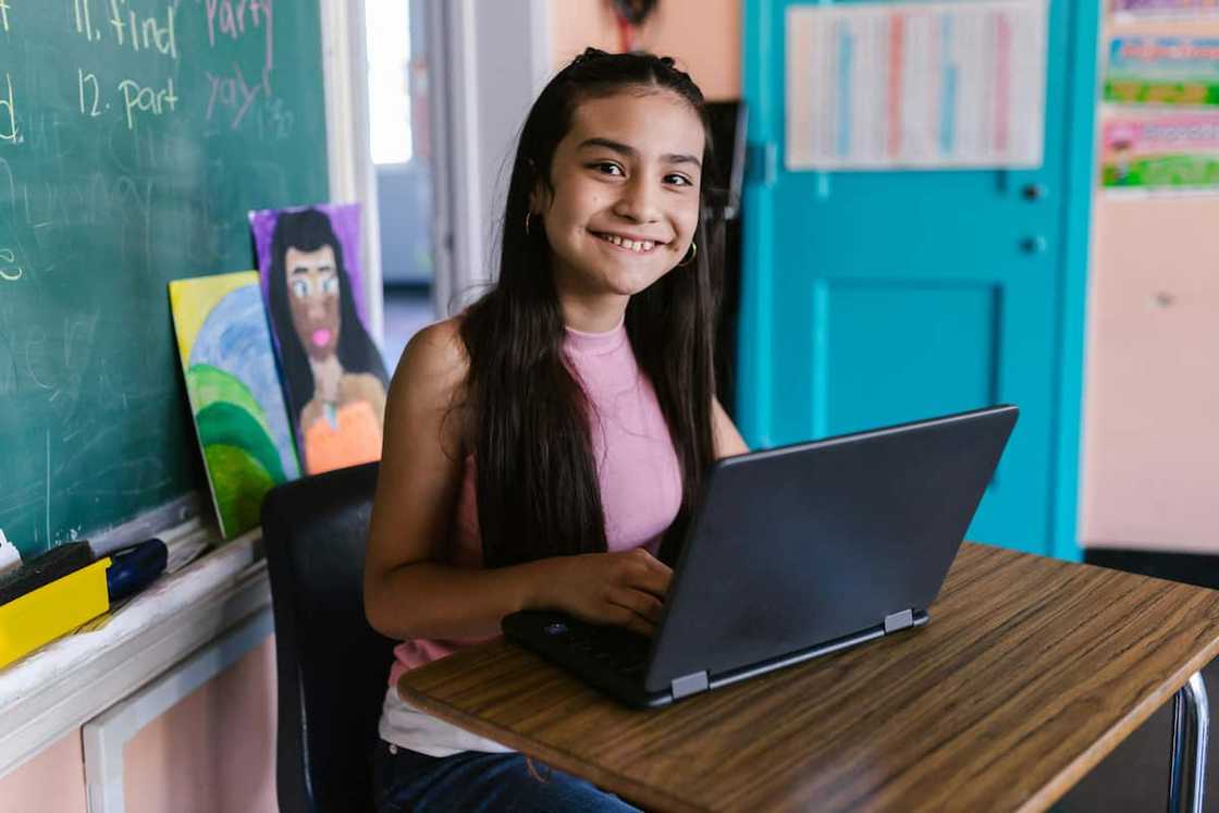 A happy student using laptop A happy student using laptop
