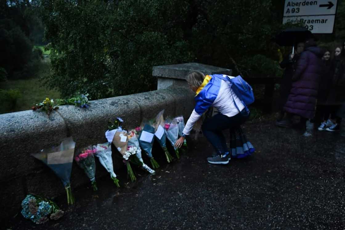 Flowers and tributes were laid at royal palaces, including outside the gates of Balmoral Flowers and tributes were laid at royal palaces, including outside the gates of Balmoral