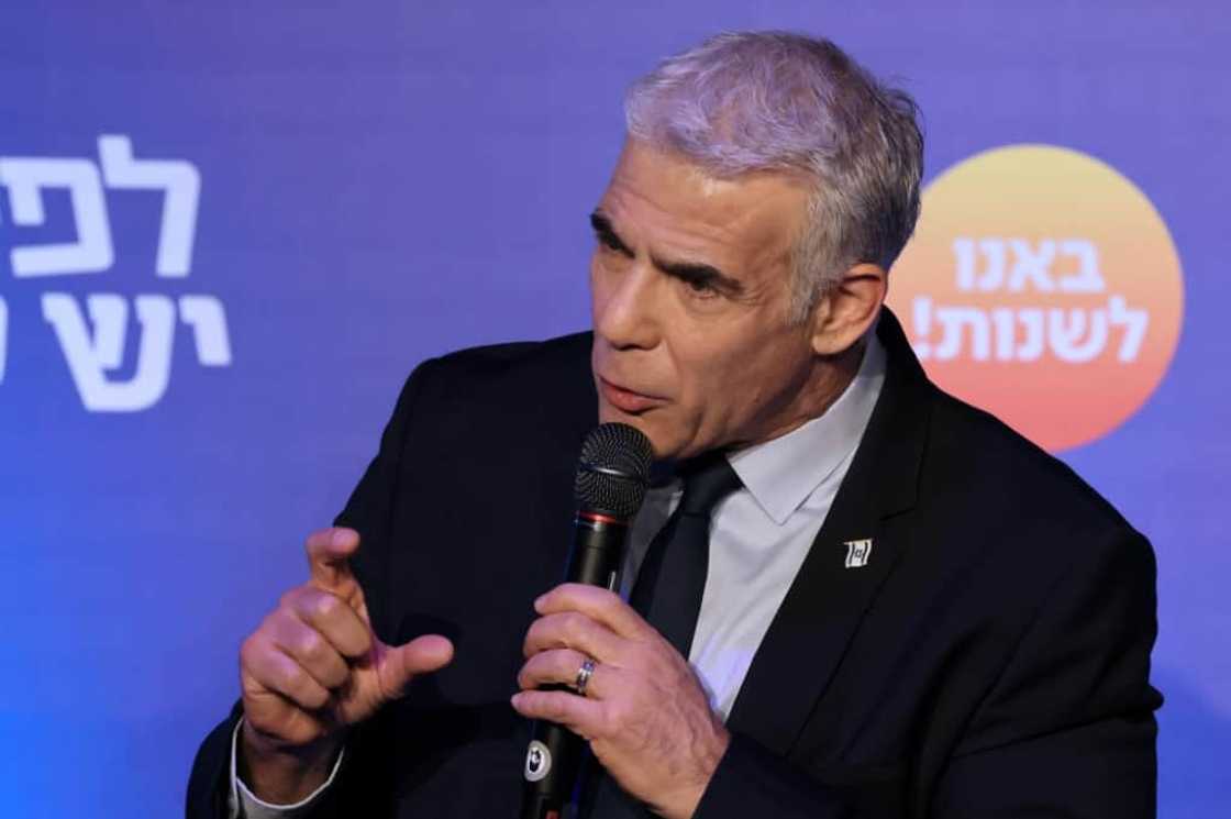 Israeli Prime Minister and head of the Yesh Atid party, Yair Lapid, speaks to supporters during a campaign rally in the northern city of Afek on October 24, 2022 Israeli Prime Minister and head of the Yesh Atid party, Yair Lapid, speaks to supporters during a campaign rally in the northern city of Afek on October 24, 2022