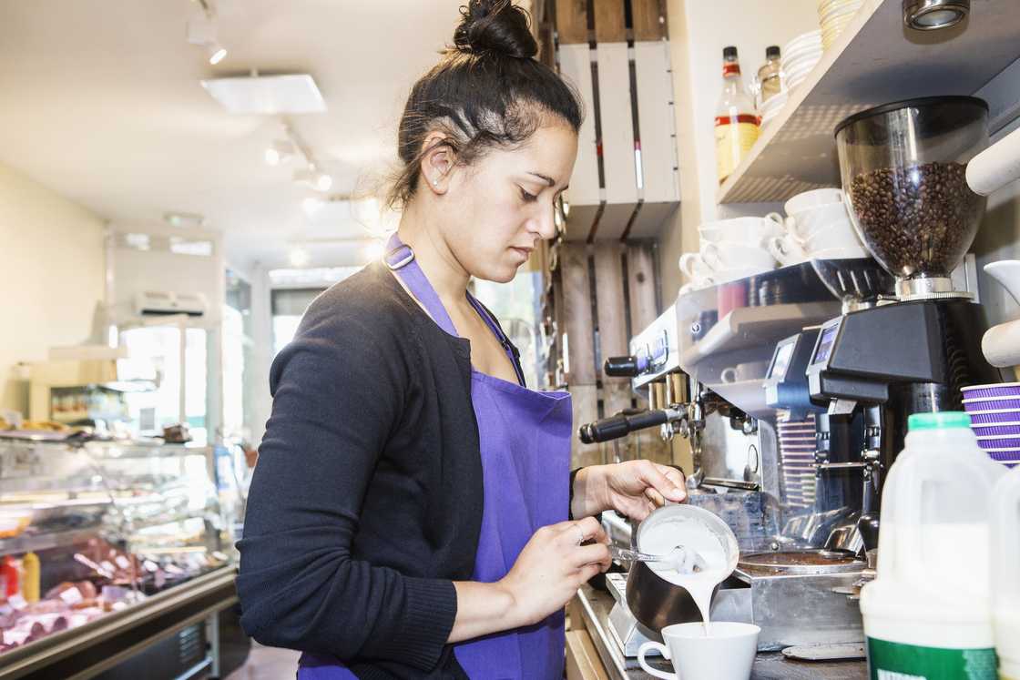 A female waitress was snapped in a coffee shop A female waitress was snapped in a coffee shop