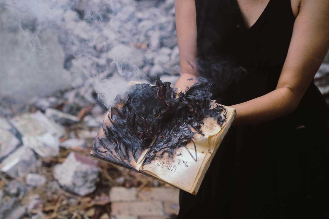 A woman with a burnt book