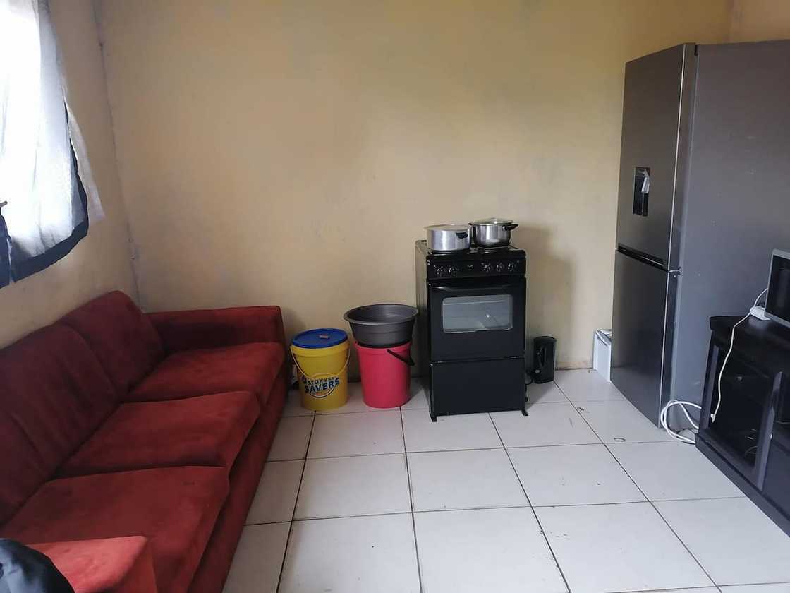 Licky Mhlongo shows off the lounge and kitchen area Licky Mhlongo shows off the lounge and kitchen area