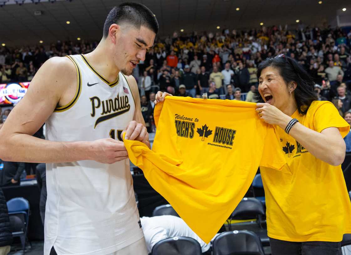 Zach Edey is presented with a tee shirt from his mother Zach Edey is presented with a tee shirt from his mother