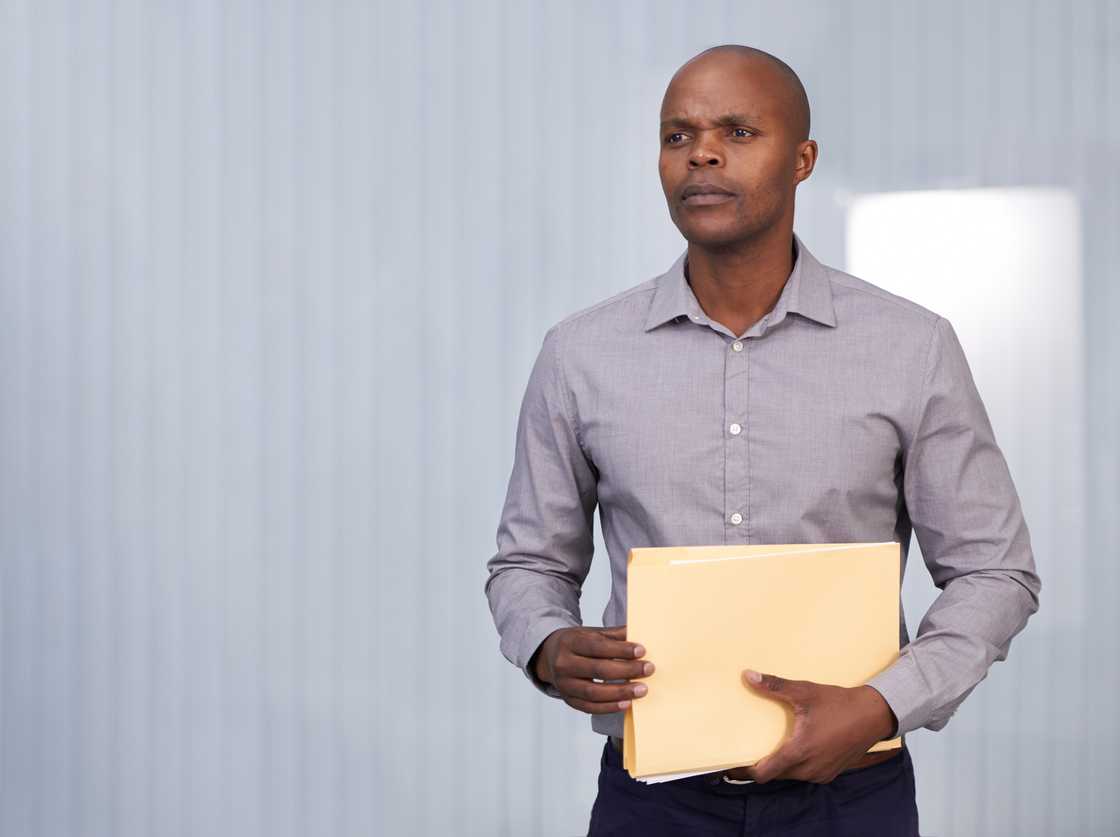 A man holding a folder