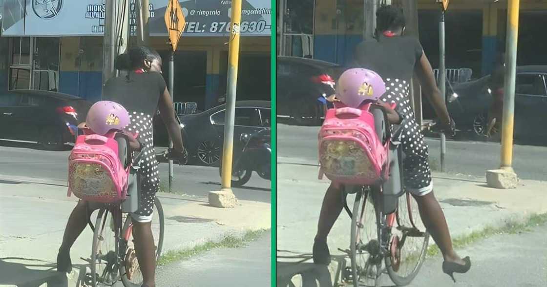 Woman in TikTok video ride bike with daughter Woman in TikTok video ride bike with daughter